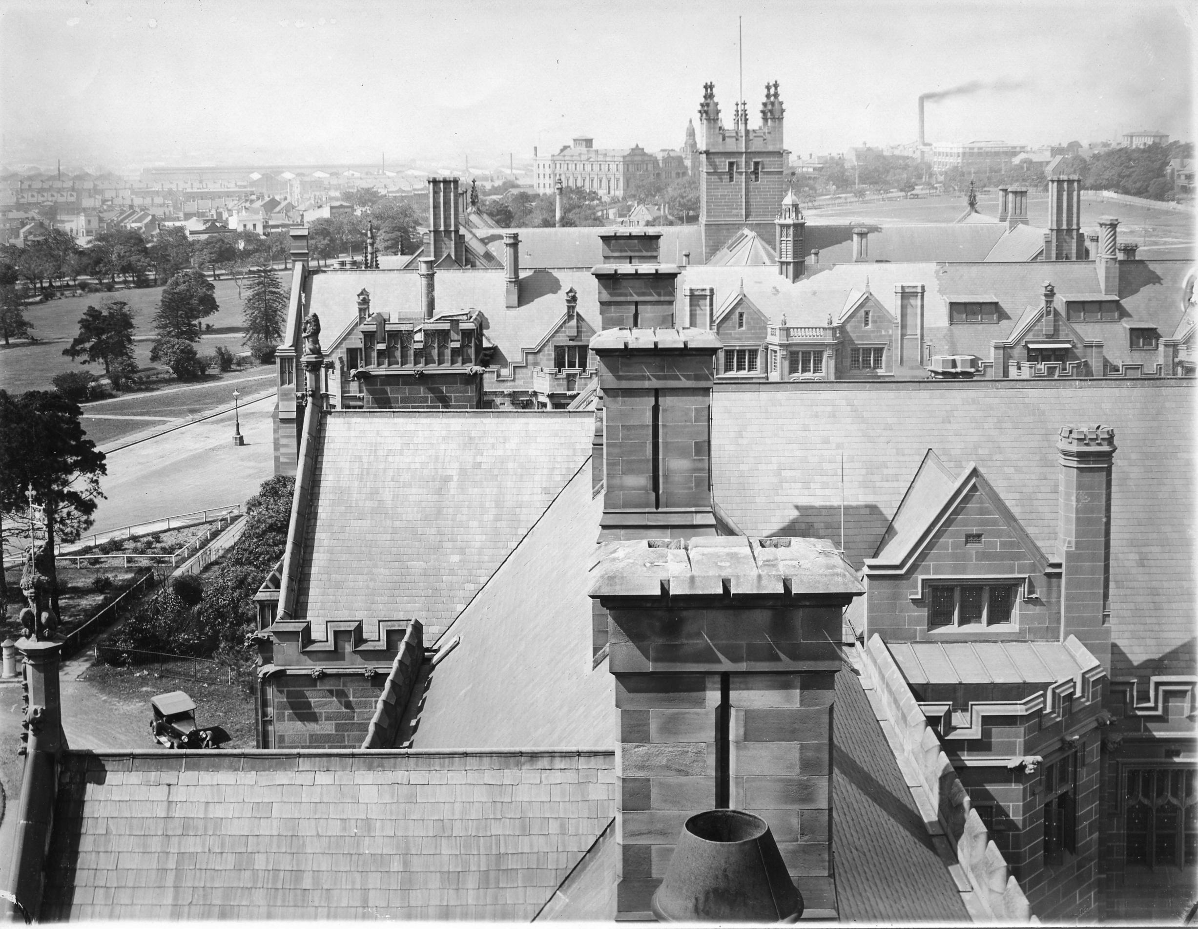 VIEW FROM CLOCK TOWER OVER ROOFS OF MAIN BUILDING AND ANDERSON STUART