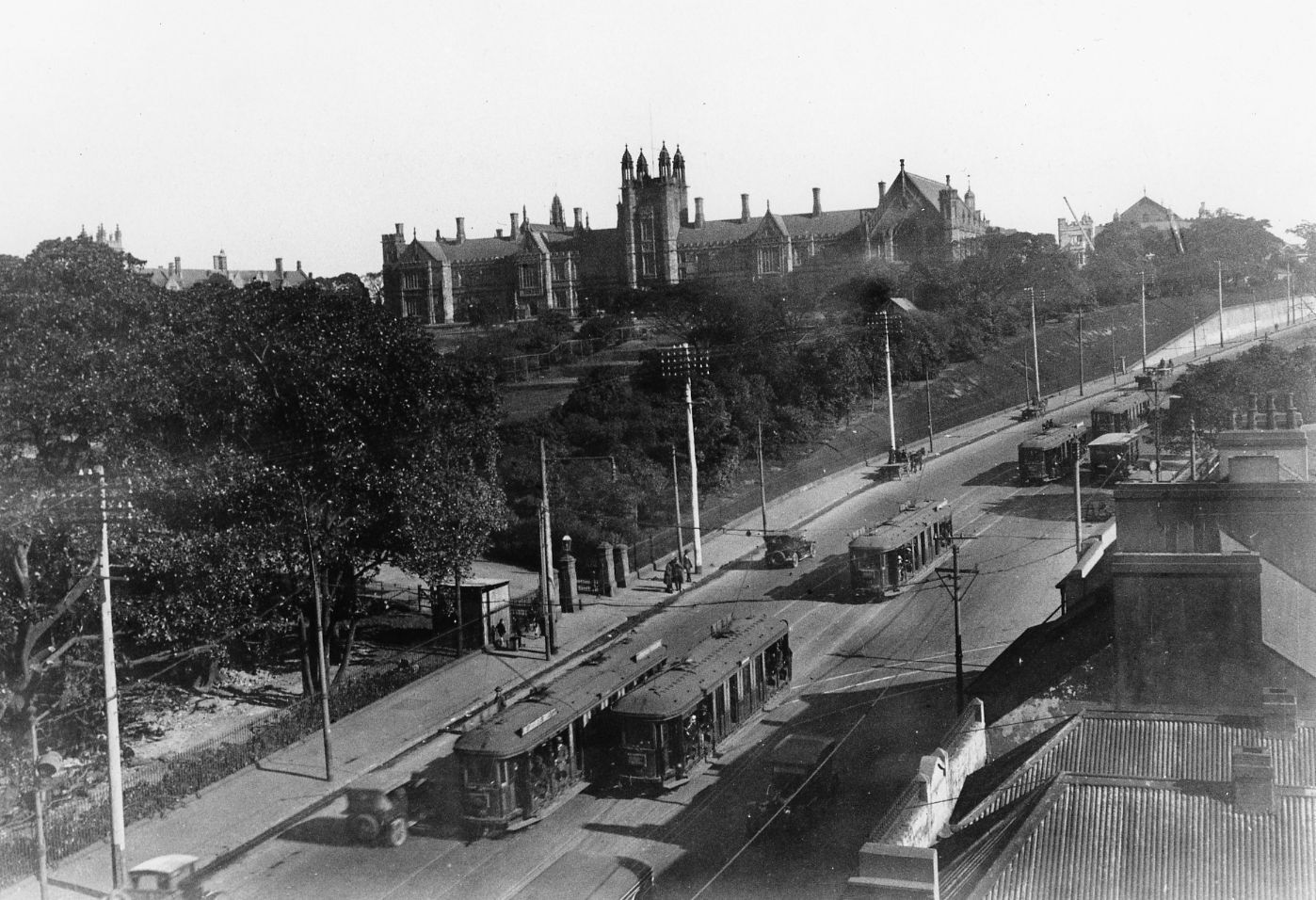 MAIN BUILDING AND GROUNDS FROM PARRAMATTA ROAD WITH TRAMS