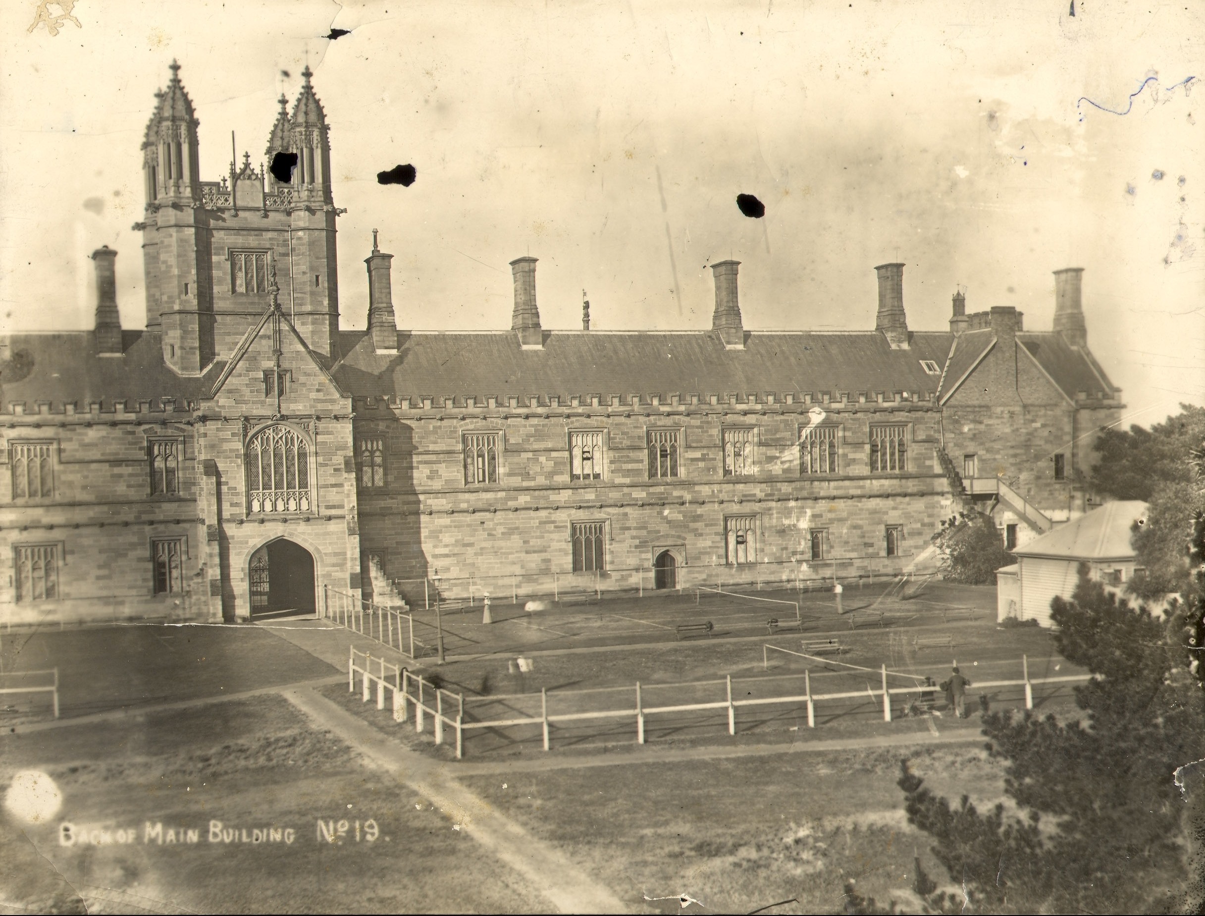 VIEW OF MAIN BUILDINGS WITH TENNIS COURT ON AREA NOW THE QUADRANGLE